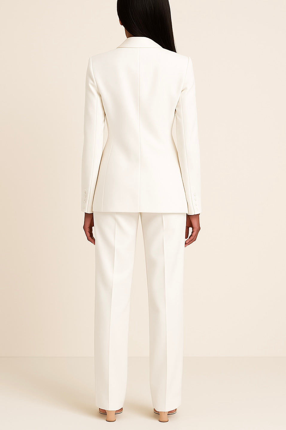 Sophisticated women's formal suit set in a rich burgundy, featuring a long blazer and well-fitted trousers.