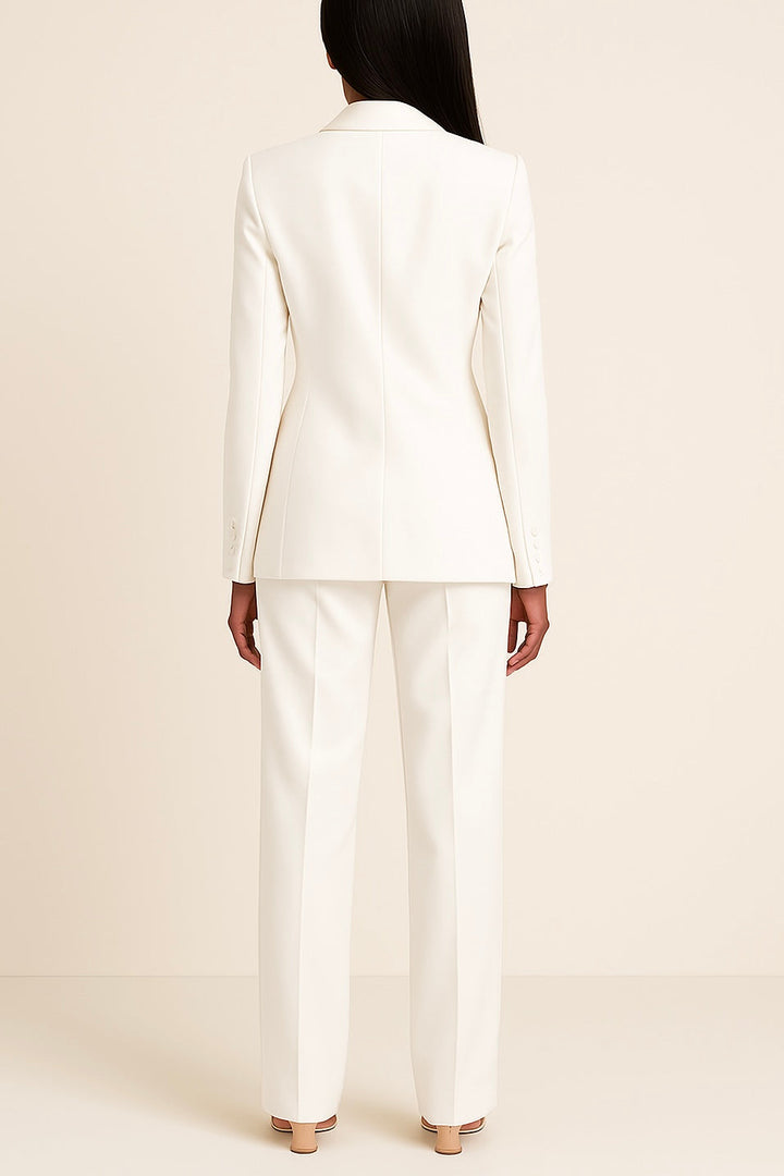 Sophisticated women's formal suit set in a rich burgundy, featuring a long blazer and well-fitted trousers.