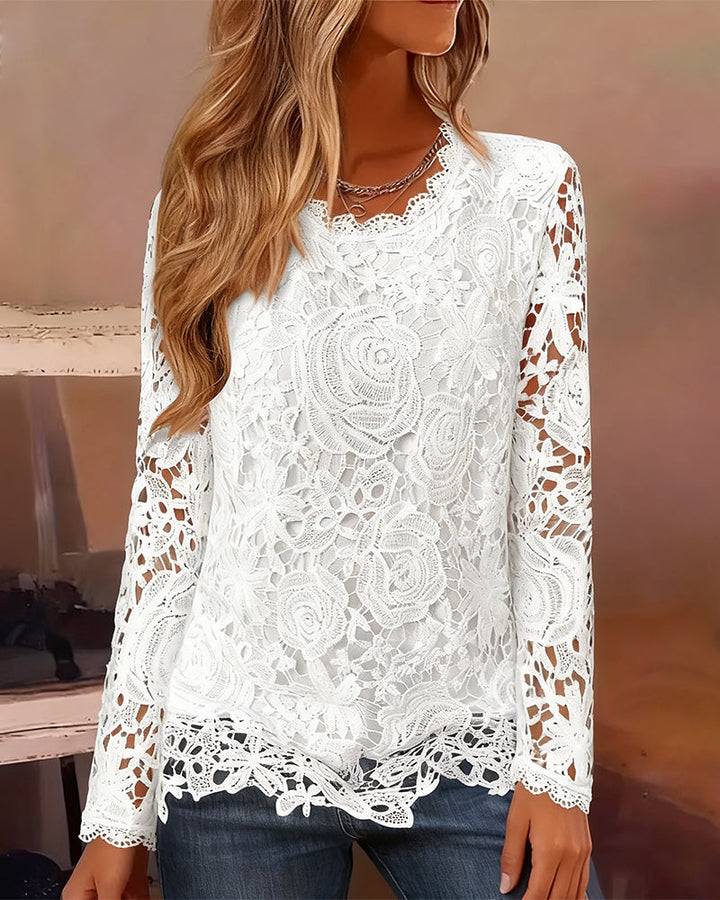 Modern women's elegant lace top with intricate floral detailing, sheer long sleeves, and a flattering V-neck cut.
