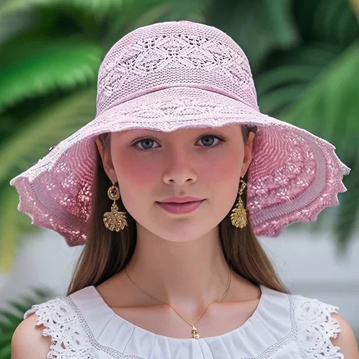 Elegant women's adjustable wide-brim sun hat. Fashionable for summer, beach, and sophisticated outdoor wear.