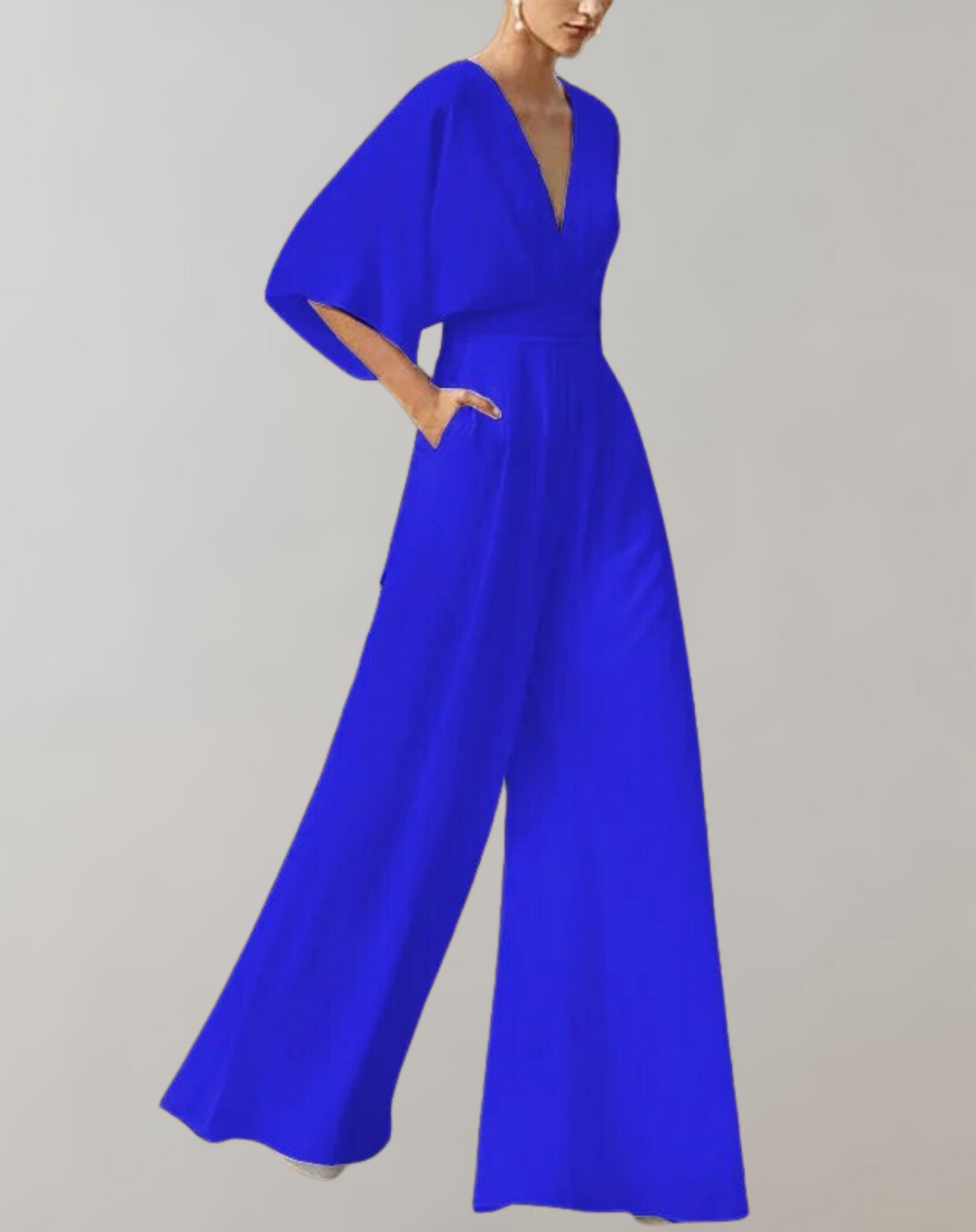 Women's elegant wide leg jumpsuit in a dynamic pose. Sophisticated evening wear, ideal for formal parties.