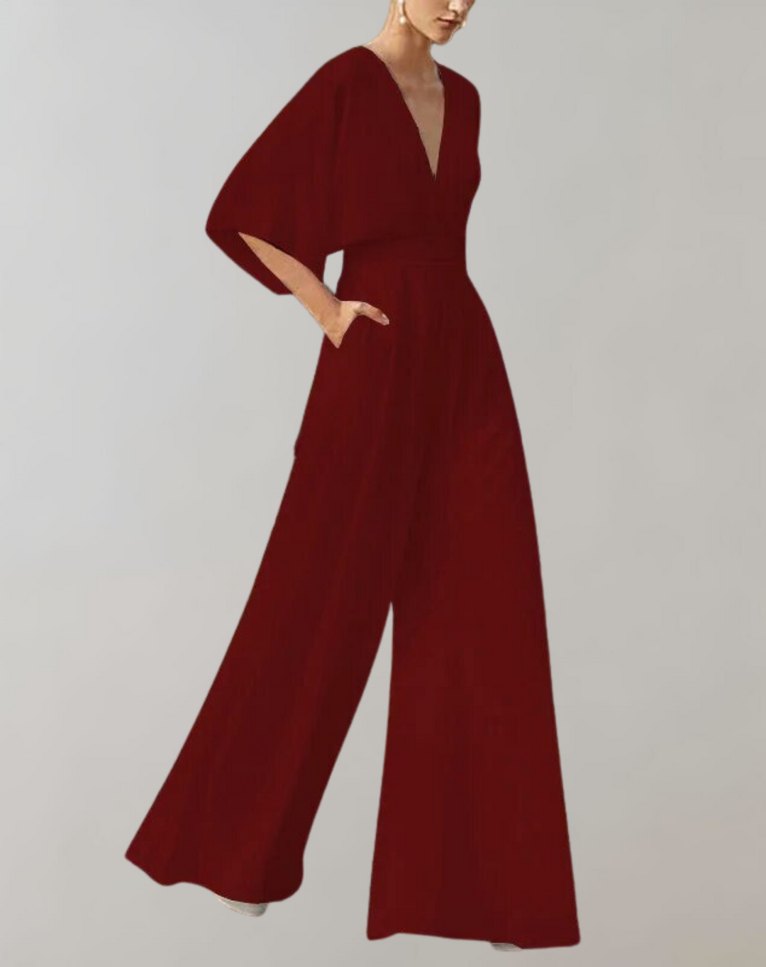 Elegant women's wide leg jumpsuit with defined waist. Sophisticated evening wear, perfect for formal events.