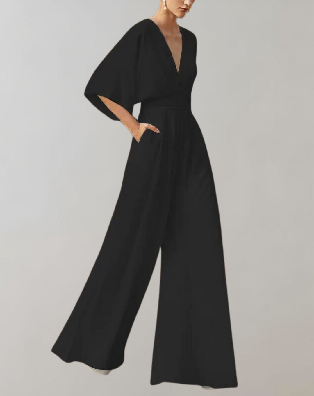 Elegant women's wide leg jumpsuit accessorized for evening events. Sophisticated formal party outfit.