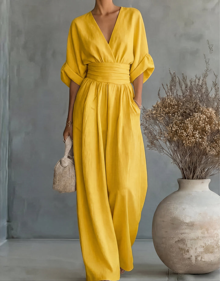 Close-up of the elegant wrap front detail on a women's stylish wide-leg fashion jumpsuit.