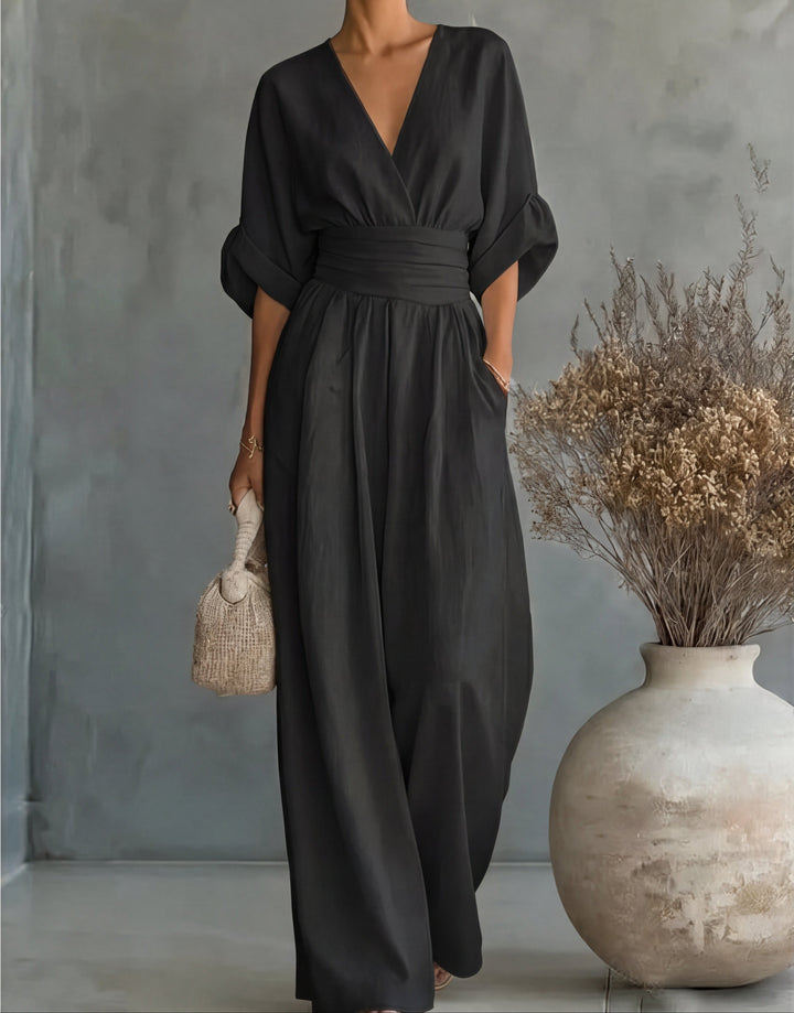 Women's elegant wide-leg jumpsuit with a stylish wrap front design, ideal for versatile fashion.