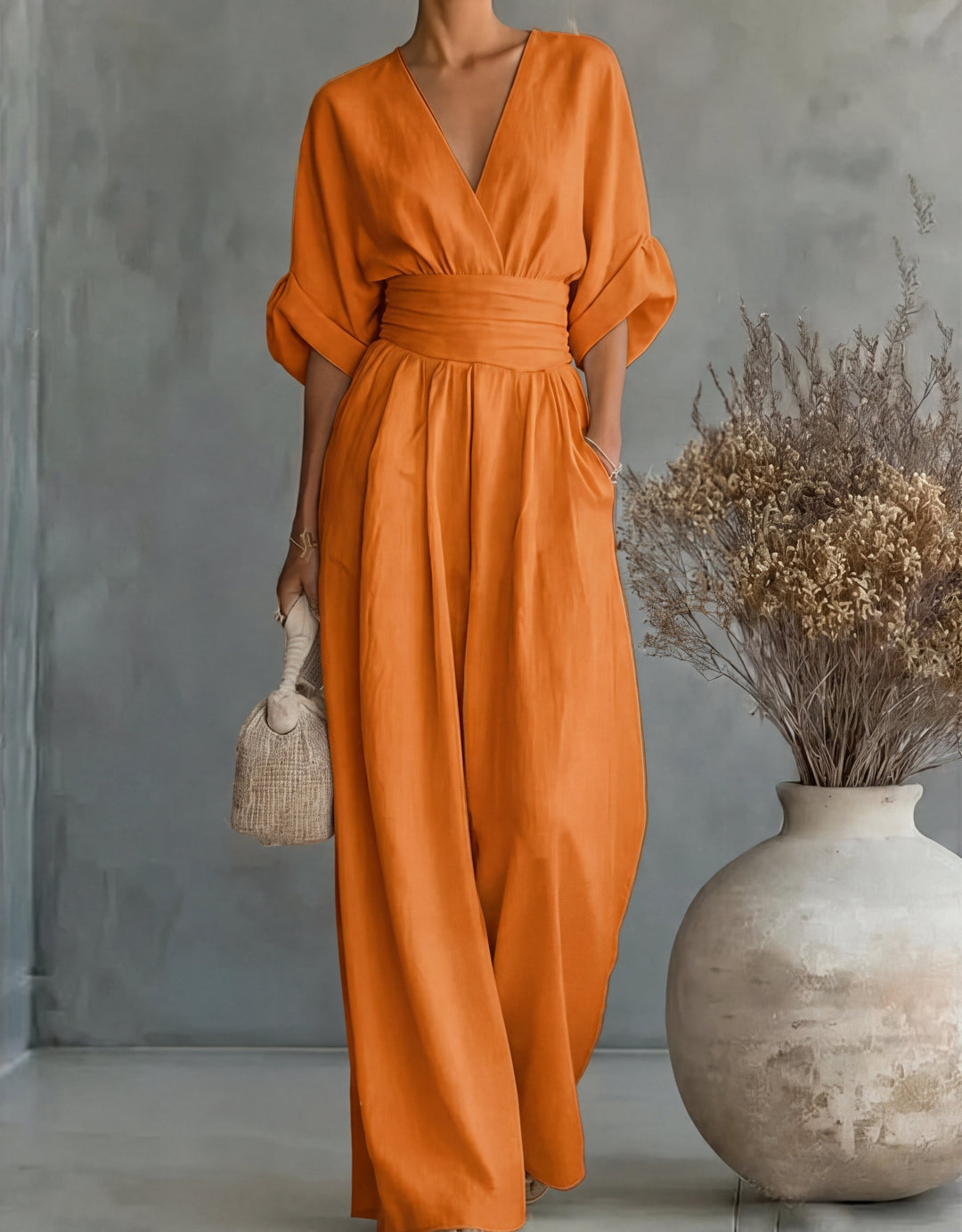 Comfortable women's one-piece wide-leg jumpsuit, featuring a chic wrap front for elegant summer style.