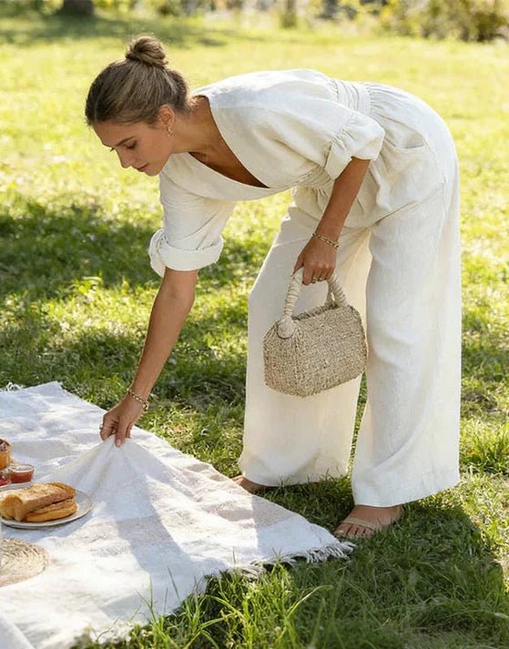Comfortable relaxed-fit women's wide-leg jumpsuit with an elegant wrap front, ideal for summer style.