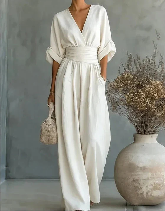 Stylish women's wide-leg wrap-front jumpsuit, a versatile one-piece for elegant fashion and casual chic.