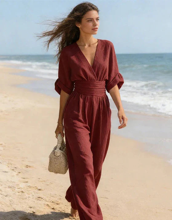Versatile women's wide-leg jumpsuit with a chic wrap front, suitable for elegant fashion or relaxed summer style.