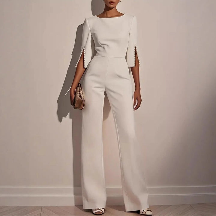 Elegant women's wide leg jumpsuit with chic pearl detail sleeves, perfect for sophisticated party or brunch wear.