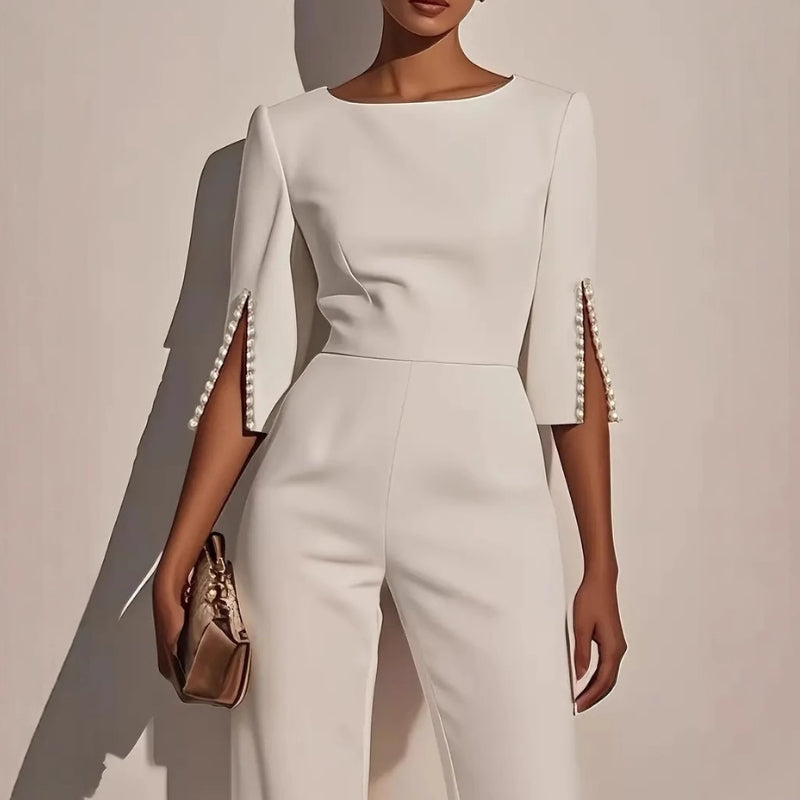 Fashionable women's one-piece wide leg jumpsuit. Features elegant pearl embellished sleeves for spring/summer style.