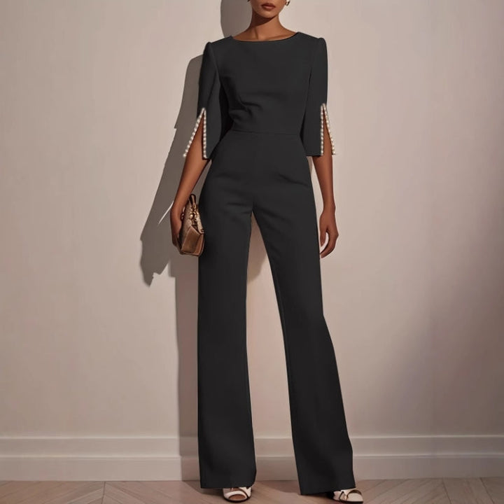 Sophisticated wide leg jumpsuit for women, showcasing unique pearl detail on sleeves, ideal for casual chic outfits.