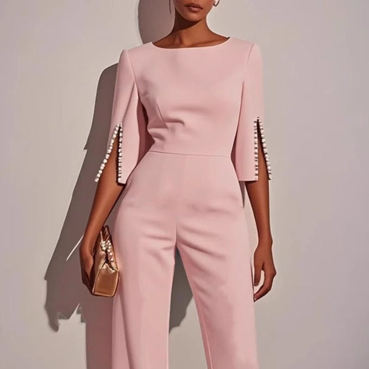 Chic women's wide leg jumpsuit featuring delicate pearl accents on sleeves, a sophisticated choice for any occasion.
