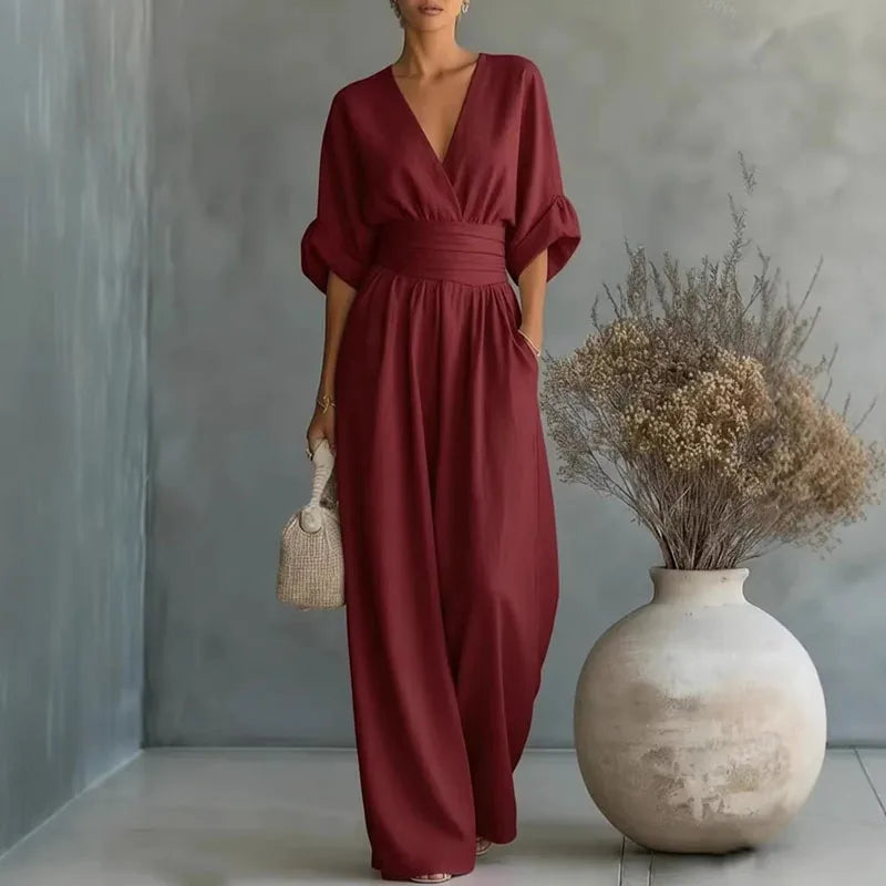 Versatile women's wide leg jumpsuit, cinched for elegance. Ideal day-to-night fashion for any occasion.