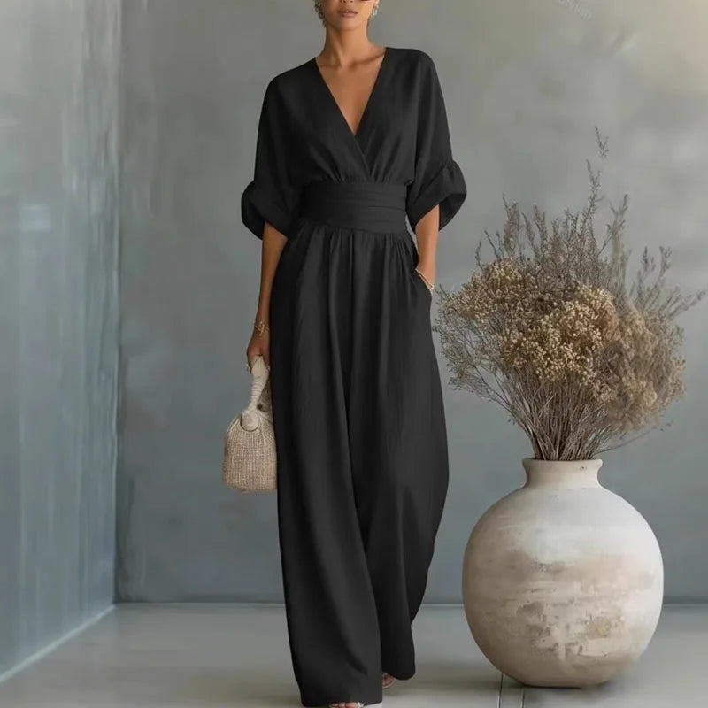 Solid color women's elegant jumpsuit with a flattering wide leg & cinched waist. Modern casual chic style.