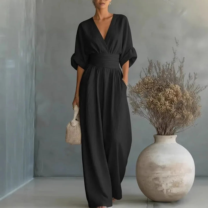 Solid color women's elegant jumpsuit with a flattering wide leg & cinched waist. Modern casual chic style.