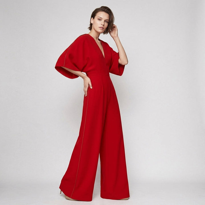 Women's elegant wide-leg jumpsuit with graceful flowing sleeves and V-neck. Versatile chic fashion wear.