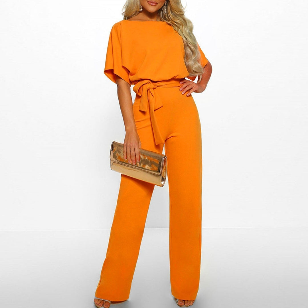 Loose-fit women's wide-leg jumpsuit. Comfortable and chic with a boat neck and adjustable self-tie belt.