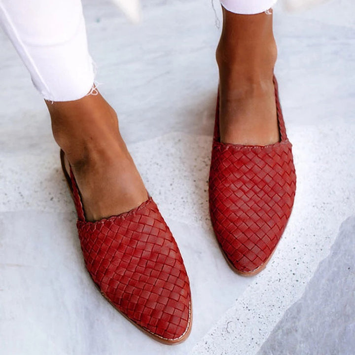 Stylish basket weave pointed toe mules for women. Comfortable slip-on flats, ideal for summer and everyday wear.