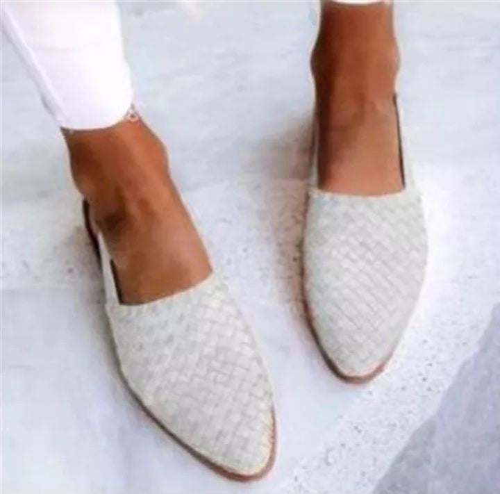 Women's comfortable light brown pointed toe mules. Elegant slip-on flat shoes with a unique woven design.