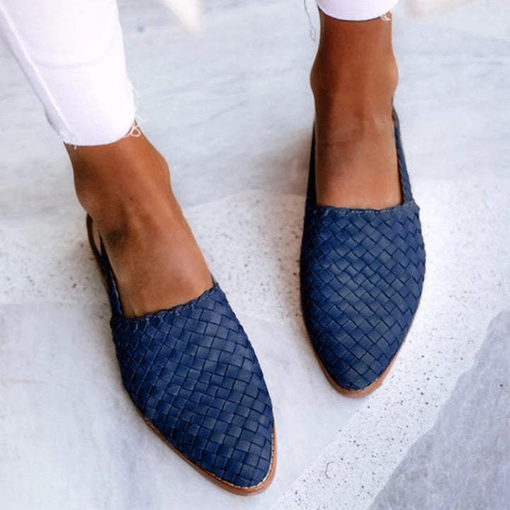 Versatile women's slip-on flat mules with an elegant pointed toe and detailed basket weave pattern. Casual or office.