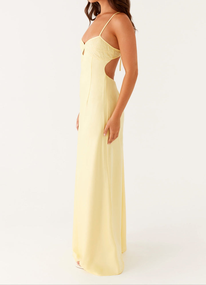 Formal women's yellow halterneck maxi dress, a stunning choice for evening wear & celebrations.