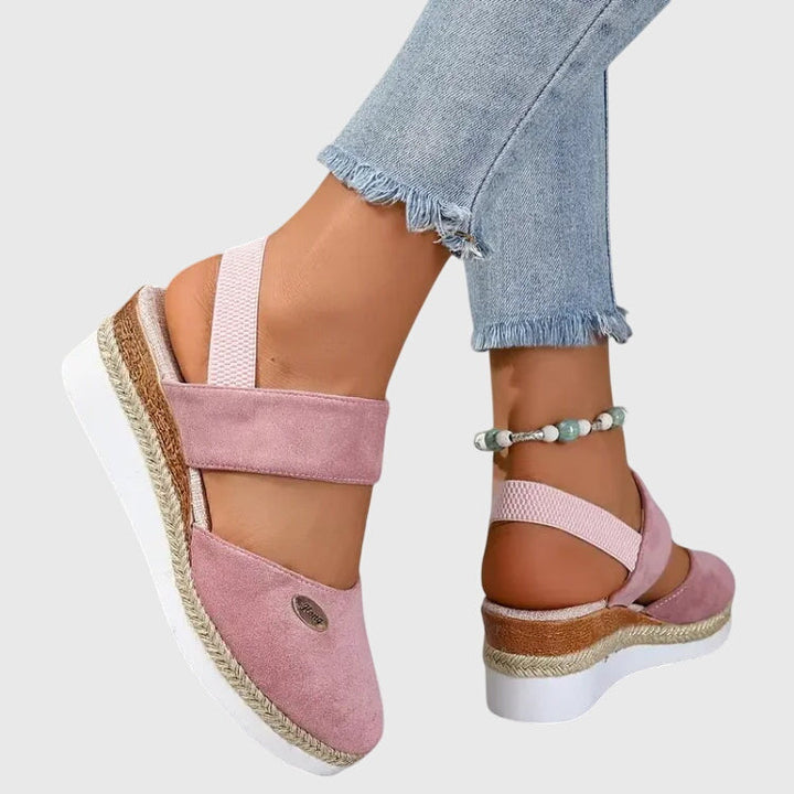 ELUXOR women's walking sandals, paired with a summer dress, offering comfort & style.