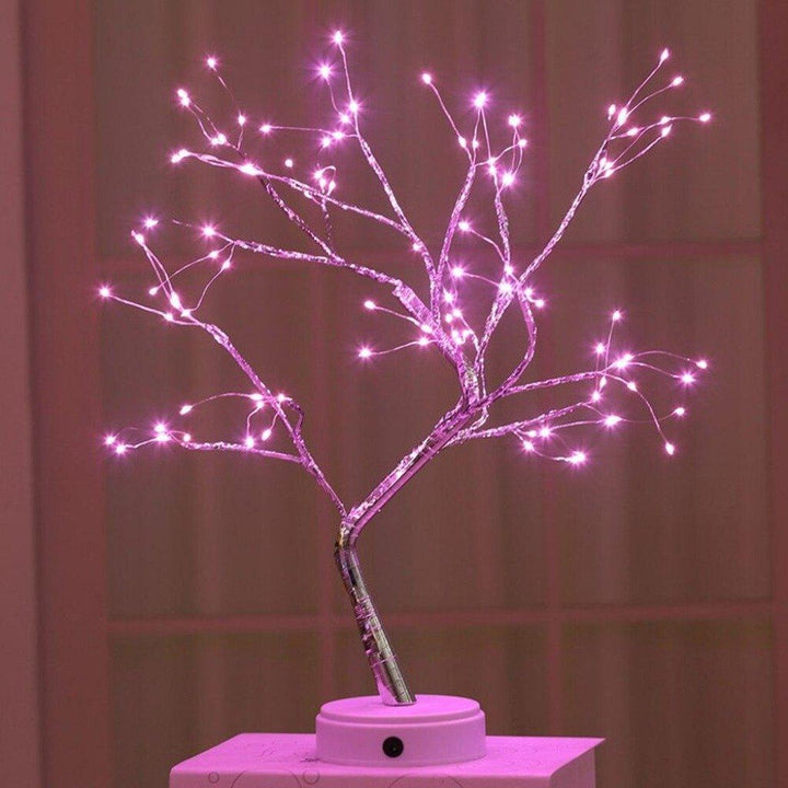 Home decor piece: Enchanted LED Bonsai Tree Lamp with glowing fairy lights on a dark background
