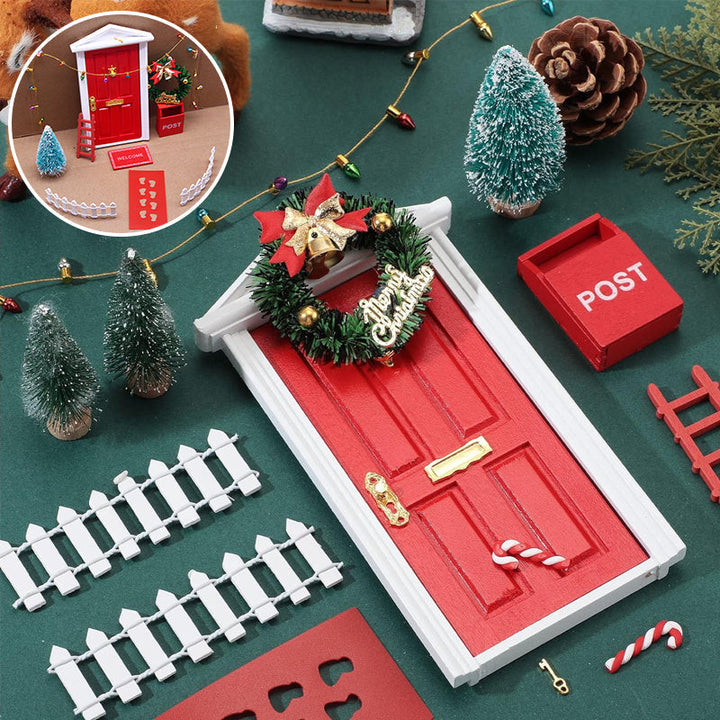 Close-up of a festive red miniature elf door with a tiny wreath, perfect for Christmas decoration