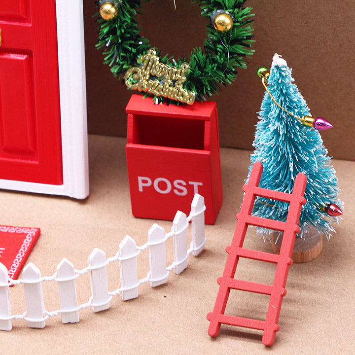 Holiday elf door kit displaying a tiny wooden door, ladder, and mailbox against a whimsical backdrop