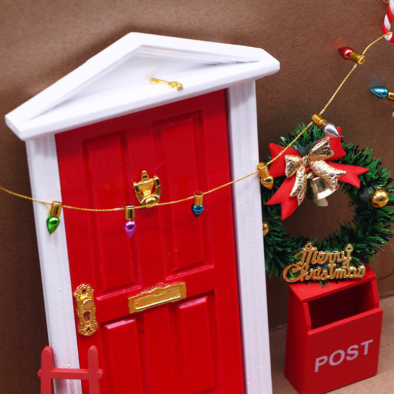 Magical Christmas elf door decoration, including tiny boots, a broom, and a welcome mat