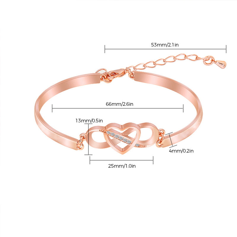 Detailed view of rose gold engraved heart bracelet, a timeless mom gift.