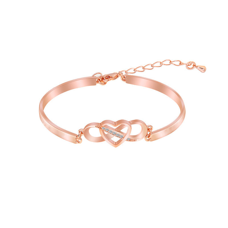Rose gold women's engraved heart bracelet, a perfect accessory for Mom.
