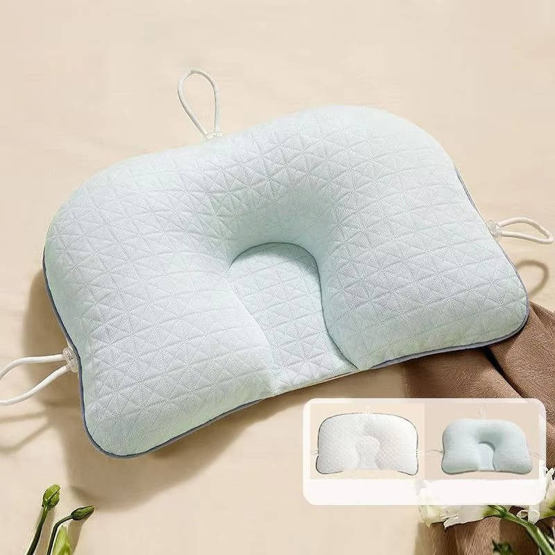 Ergonomic baby pillow for flat head prevention. Soft, breathable infant support for newborns & safe sleep.