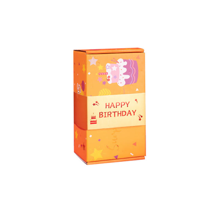 A couple enjoying the surprise from an Exploding Gift Box, filled with colorful bouncing cubes.