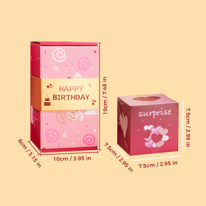 Close-up of the bouncing cubes inside the Exploding Surprise Gift Box, mid-air action.