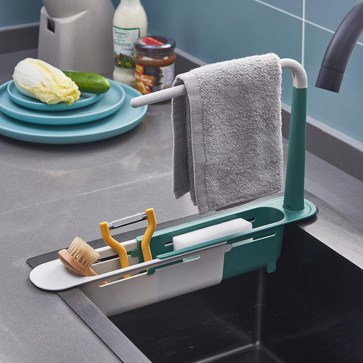 Modern kitchen sink caddy, holds sponges, brushes, and soap, with integrated drain holes