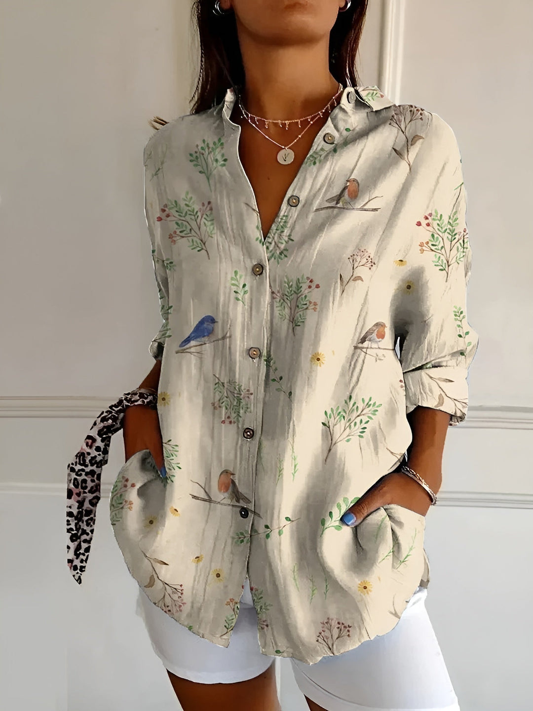 Elegant women's patterned blouse, button-front design, three-quarter sleeves & classic collar. Stylish for any occasion.