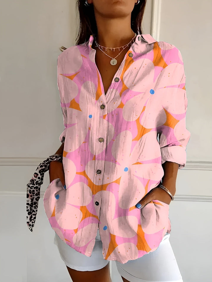 Soft flowy women's printed button-front blouse with three-quarter sleeves, perfect casual wear for spring/summer.