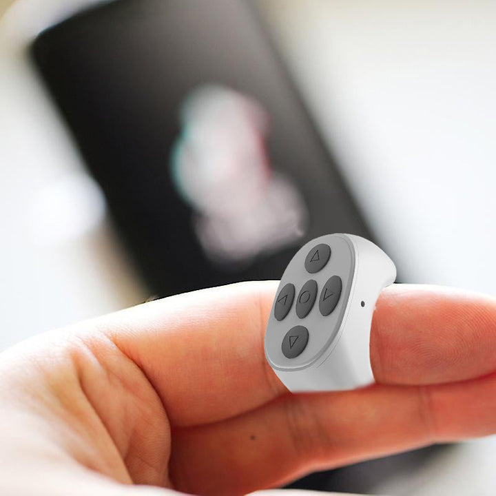 User wearing Fingertip Wireless Bluetooth Control Ring, demonstrating its comfortable fit