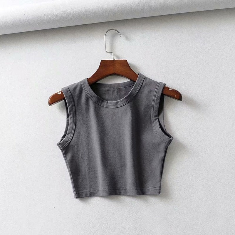 Breathable women's sleeveless crop top, fitted for lightweight comfort during warm summer days.
