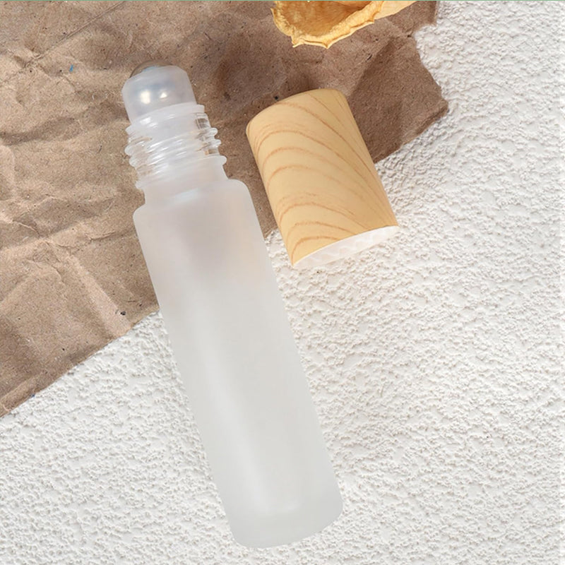 Compact and refillable glass roller bottles with stainless steel tops, excellent for beauty accessories and travel kits