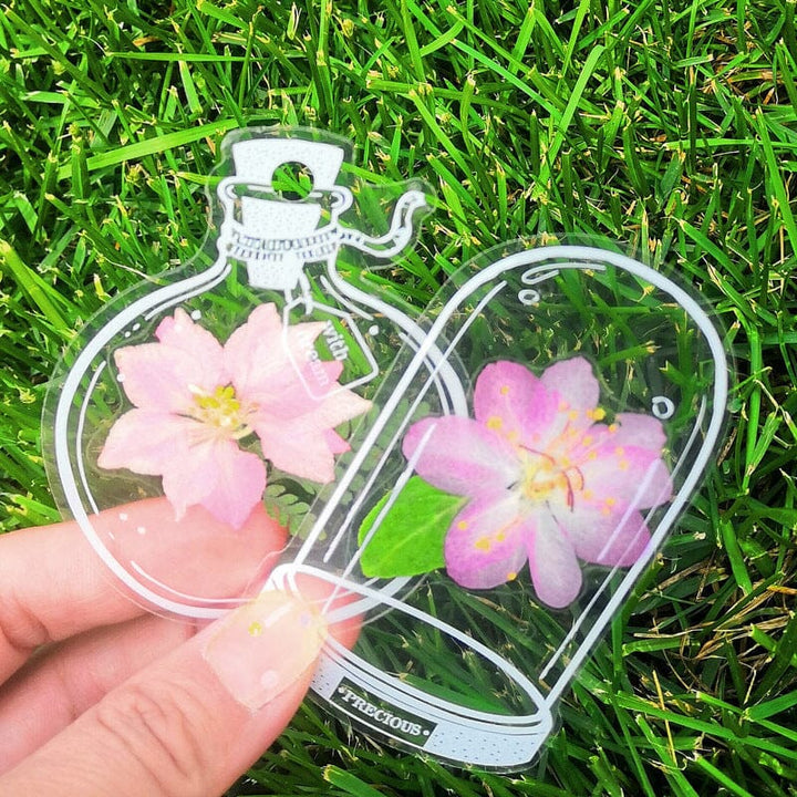 Transparent bookmark with embedded colorful wildflowers, perfect for readers