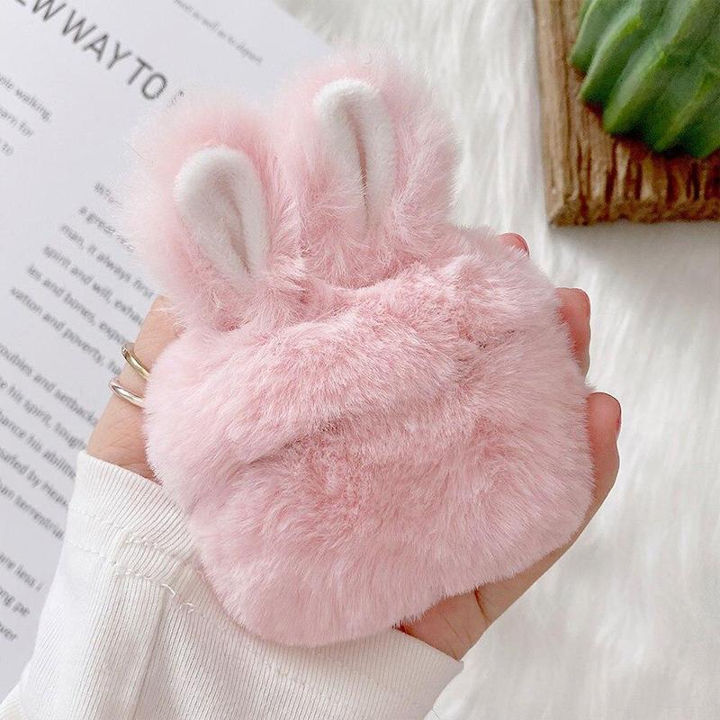 Pink fluffy earbud case, side view, protective cover with keychain for earphone storage