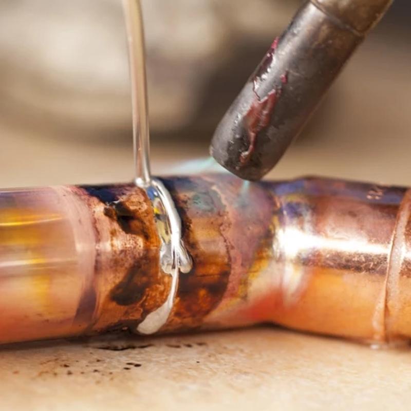 Assorted flux-cored welding rods for various metal types, ideal for welding and brazing