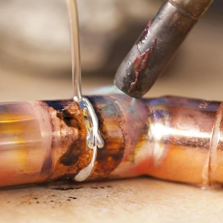 Assorted flux-cored welding rods for various metal types, ideal for welding and brazing