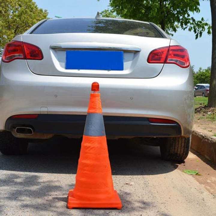 Bright orange foldable safety cone with reflective bands and LED warning light for cars