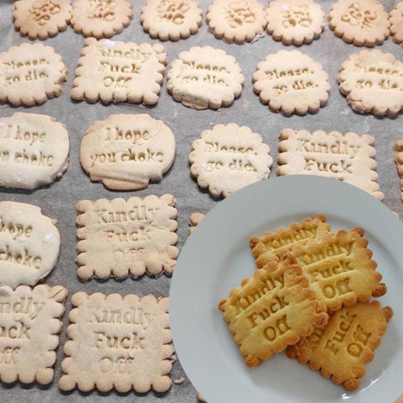 Close-up of orange cookie molds featuring unique fun phrases, perfect DIY baking tools.