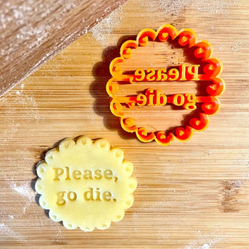 DIY baking essential: 4 orange cookie molds with engraved fun phrases, great for novelty cookies.
