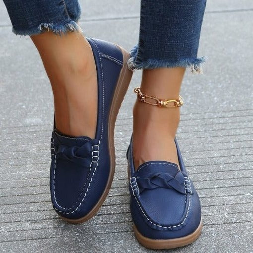 Front view of women's slip-on walking loafers in black, perfect for everyday comfort and support.
